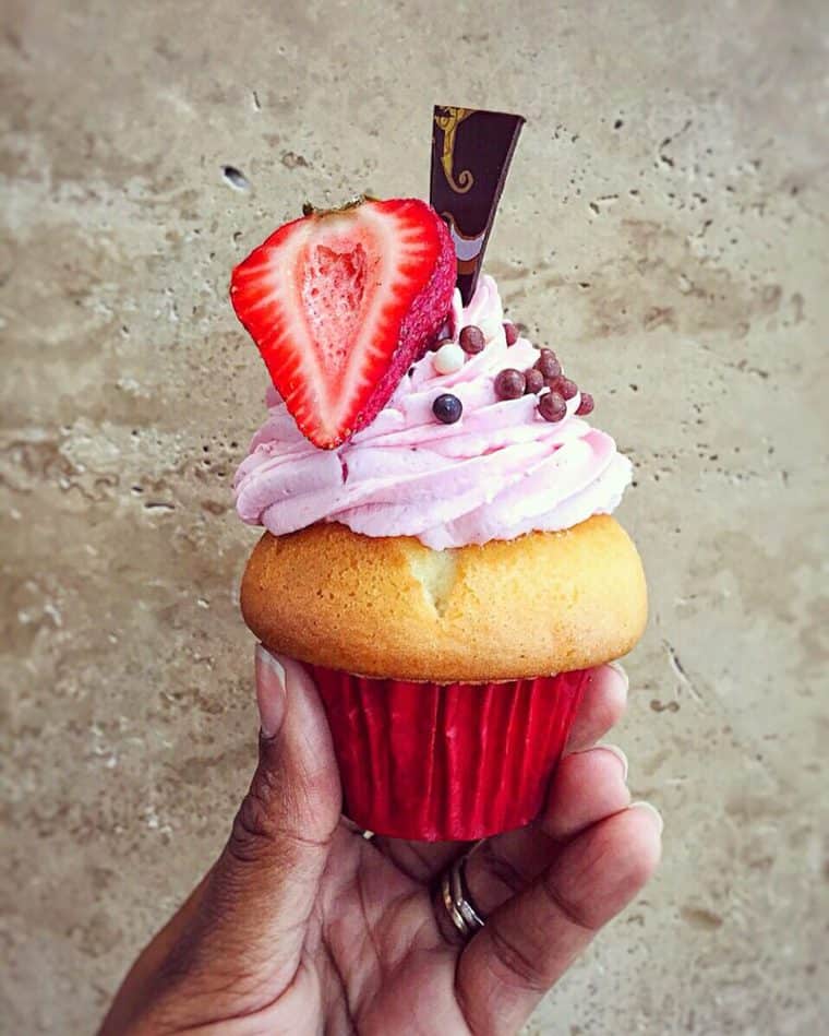 Jocelyn Delk Adams holding a fun cupcake from Baby Cakes in Las Vegas