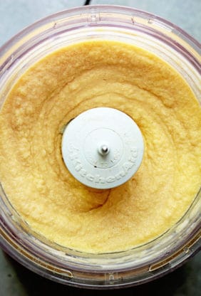 Smooth peach frozen yogurt in the food processor ready to serve