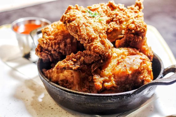 Small black cast iron skillet full of Yardbird's Fried Chicken at the Venetian resort in Las Vegas