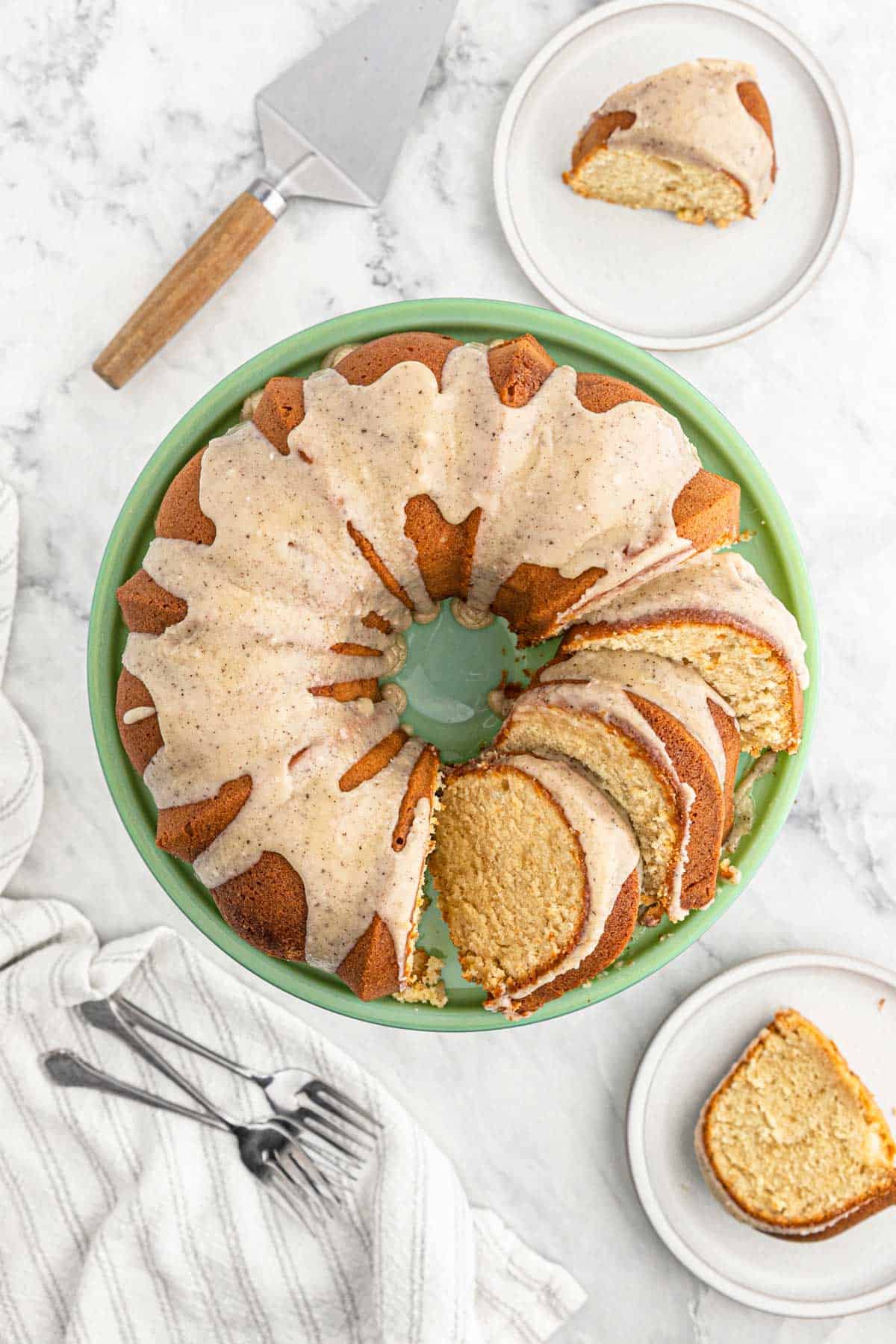 Brown Sugar Pound Cake with Brown Butter Glaze with a slice missing on a circular, white plate