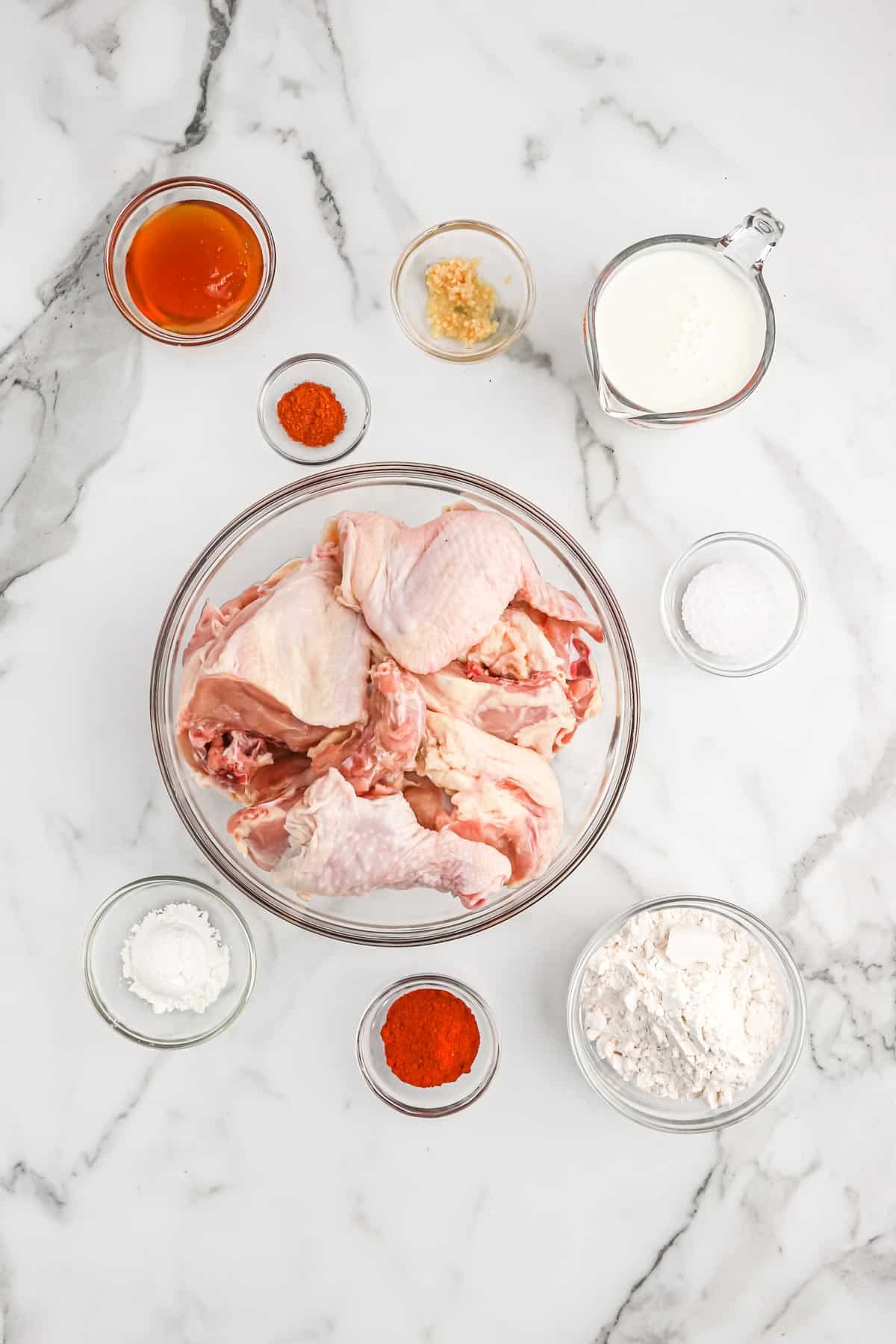 Ingredients to make buttermilk fried chicken on the countertop.