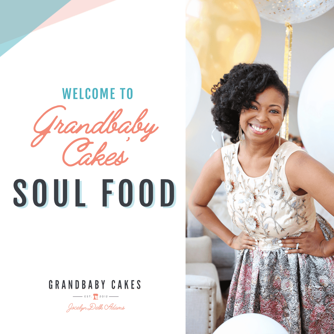 Jocelyn Delk Adams smiling with her hands on her hips and wearing a sleeveless dress and balloons in the background with the words, "Welcome to Grandbaby Cakes' Soul Food" on the left