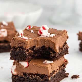 Peppermint One Bowl Brownies stacked on a white background