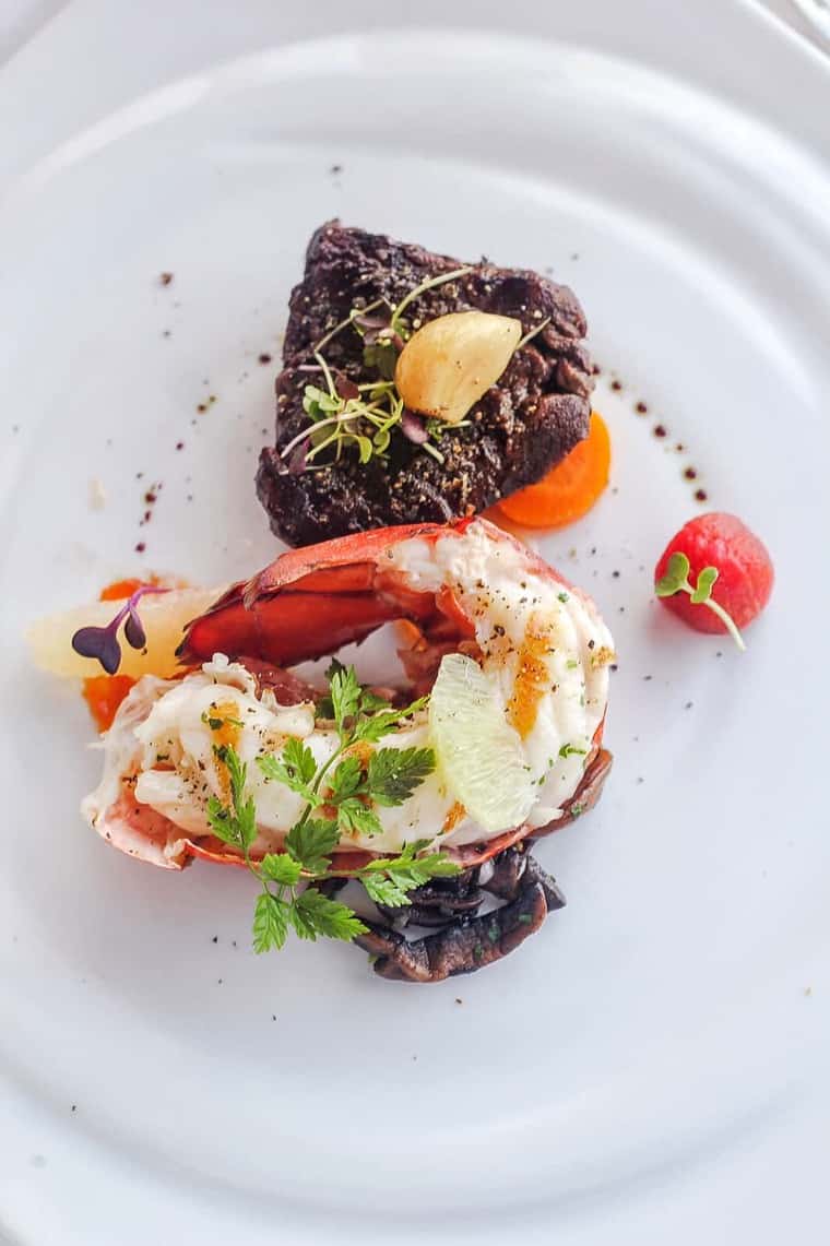 Overhead shot of surf and turf on a white plate