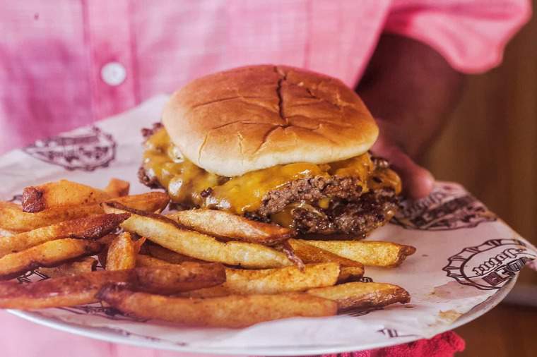 A cheeseburger and fries from Guy's Burger Point on the Carnival Pride