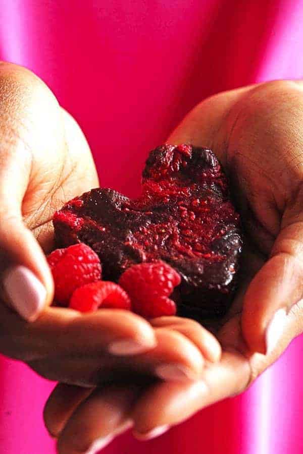 A Perfect raspberry swirled brownie in a heart shape ready to serve