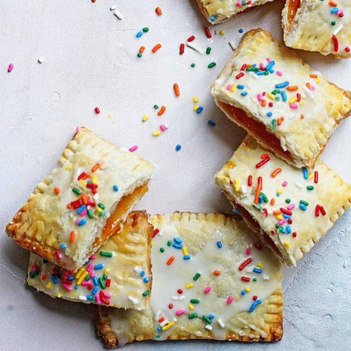 Homemade Pop Tarts piled on top of each other and cut in half so you can see the filling inside.
