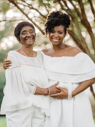 Jocelyn Delk Adams with her grandmother holding her pregnant belly