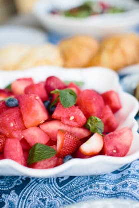 Close up of a fruit salad featuring watermelon, blueberries and strawberries