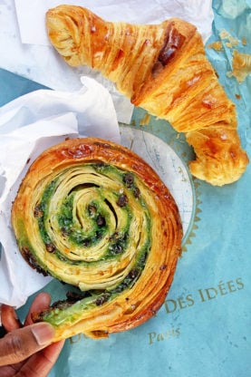 Overhead shot of a chocolate croissant and pastry at Du Pain et des Idees in Paris, France