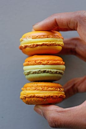 Macaroons being held from Pierre Herme