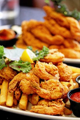 Fried shrimp piled high on top of fries at Deanie’s in NOLA