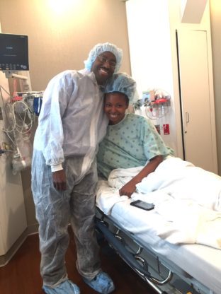 Jocelyn Delk Adams and her husband share a hug before the IVF Transfer Process