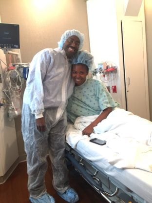 Jocelyn Delk Adams and her husband share a hug before the IVF Transfer Process