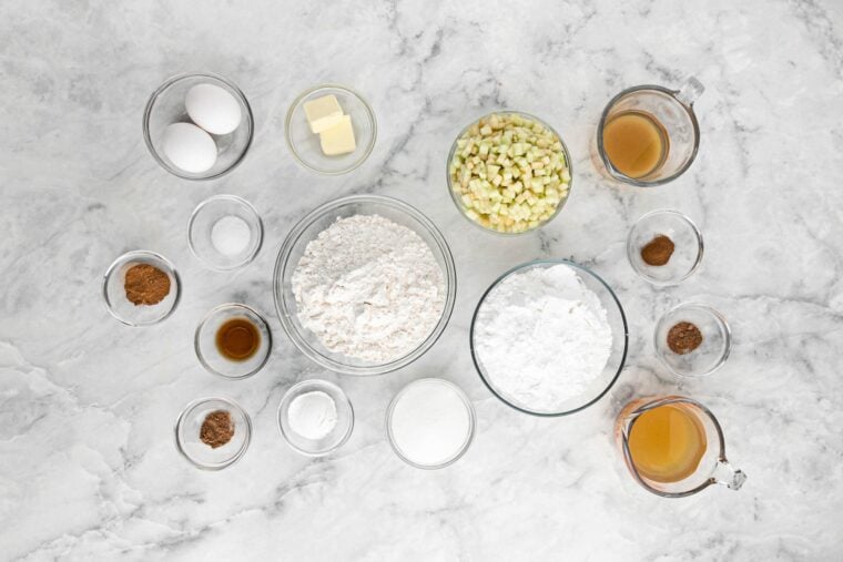 Ingredients to make apple donut fritters on the countertop.