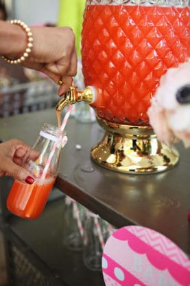 Baby Shower Punch being poured into an empty glass with a straw