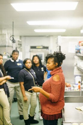 Jocelyn speaking to her students