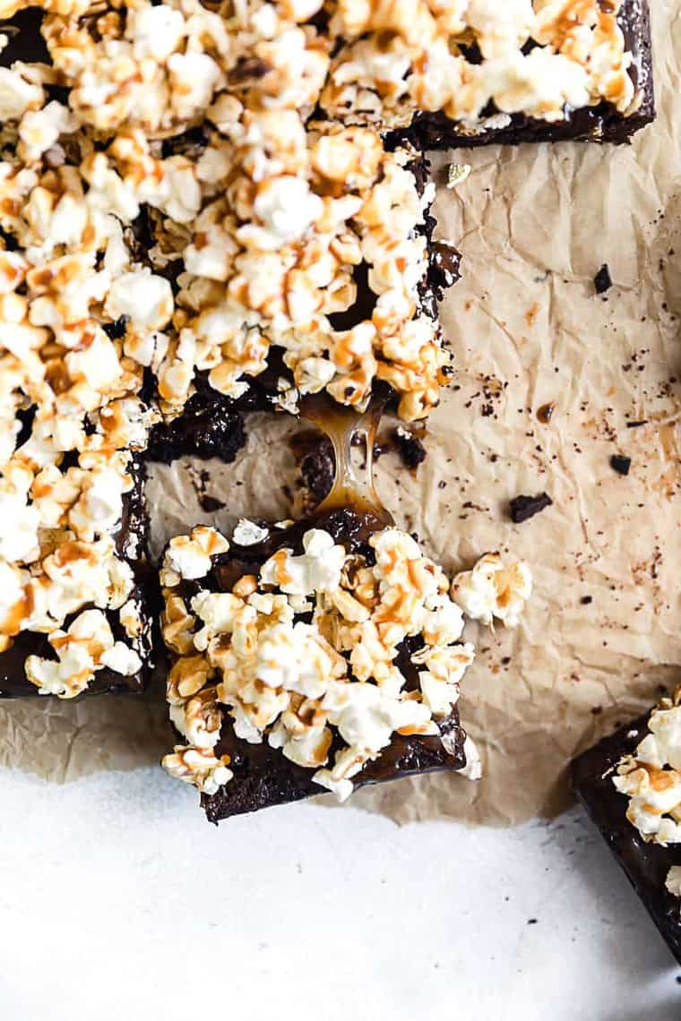 Overhead shot of Salted Caramel Popcorn Brownies on top of parchment paper