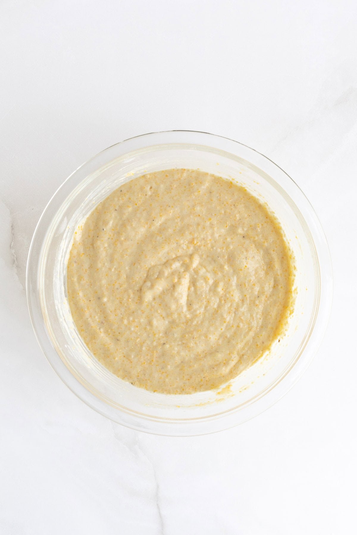 Final cornbread muffin batter fully combined and ready to be portioned