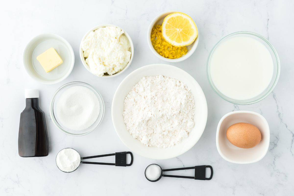 Ingredients to make lemon ricotta pancakes on the table before mixing. 