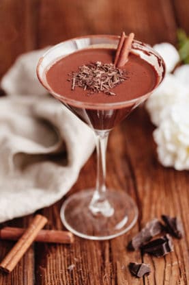 A close up of Chocolate Martini recipe with cinnamon stick ready to serve