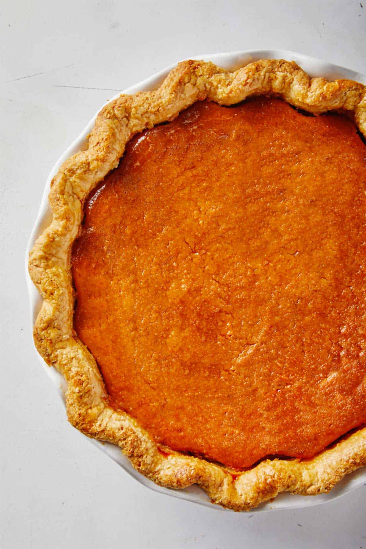 A sweet potato pie on the table after baking.