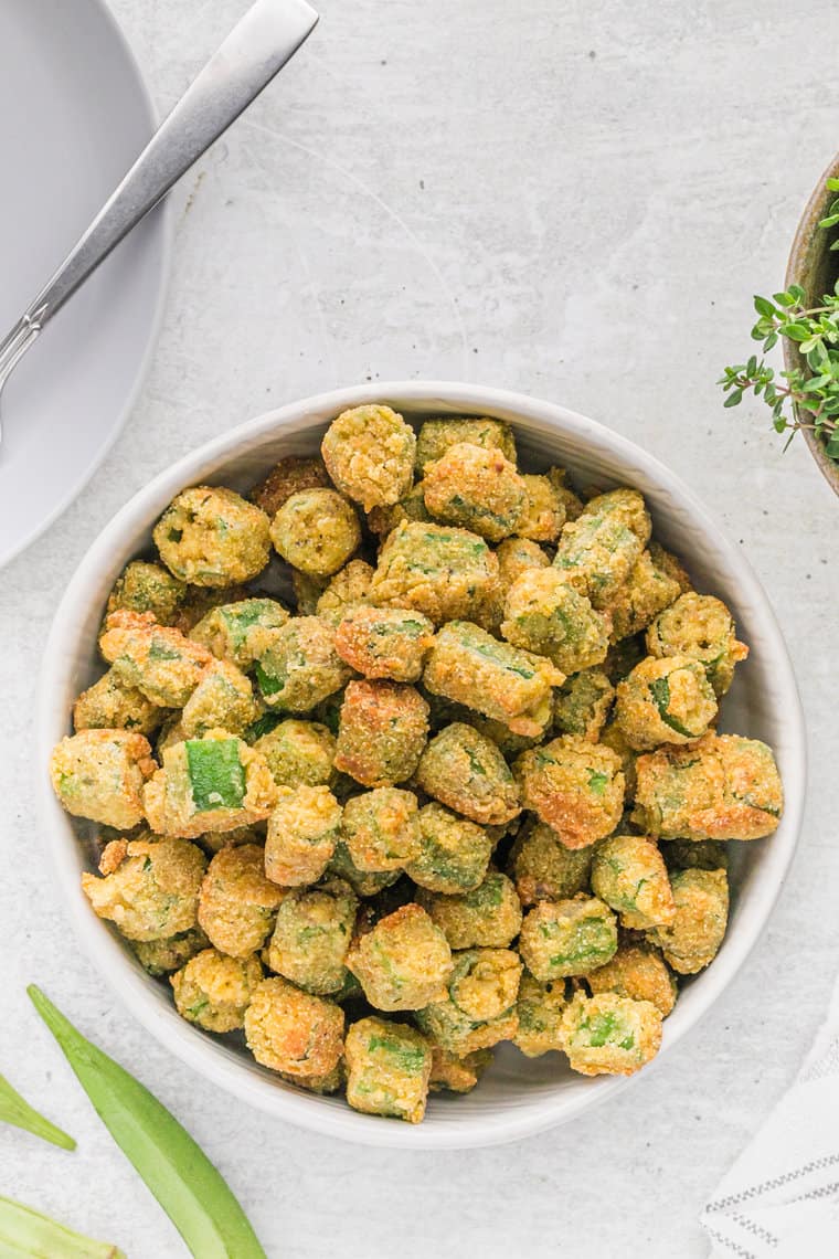 A white bowl filled with fried okra