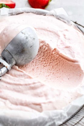 Close up of Homemade Strawberry Ice Cream recipe being scooped