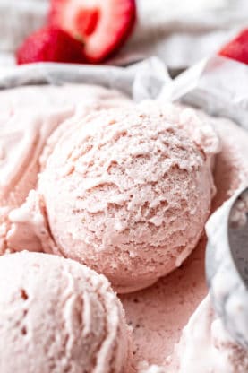 Close up of two scoops of Homemade Ice Cream with Strawberries
