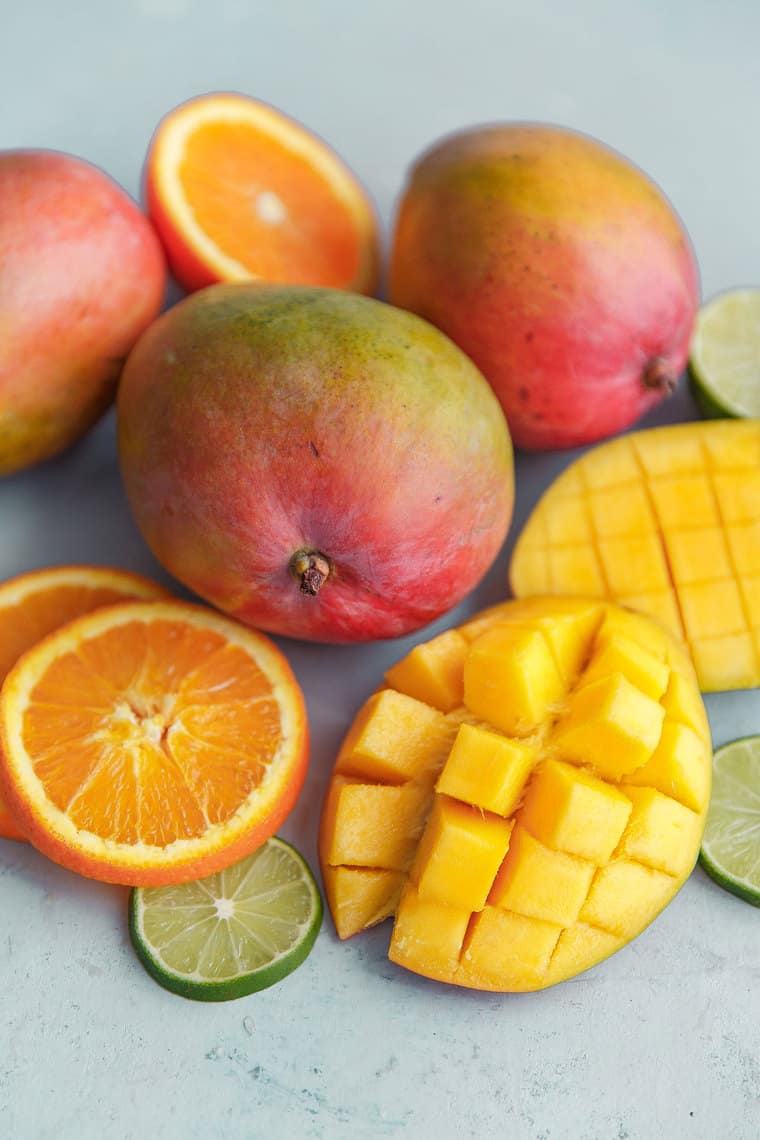 Sliced oranges, mangoes and limes used to make this mango citrus fruit punch recipe