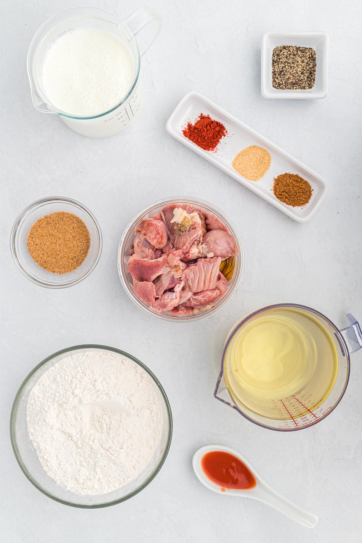Ingredients to make southern fried chicken gizzards on the table.