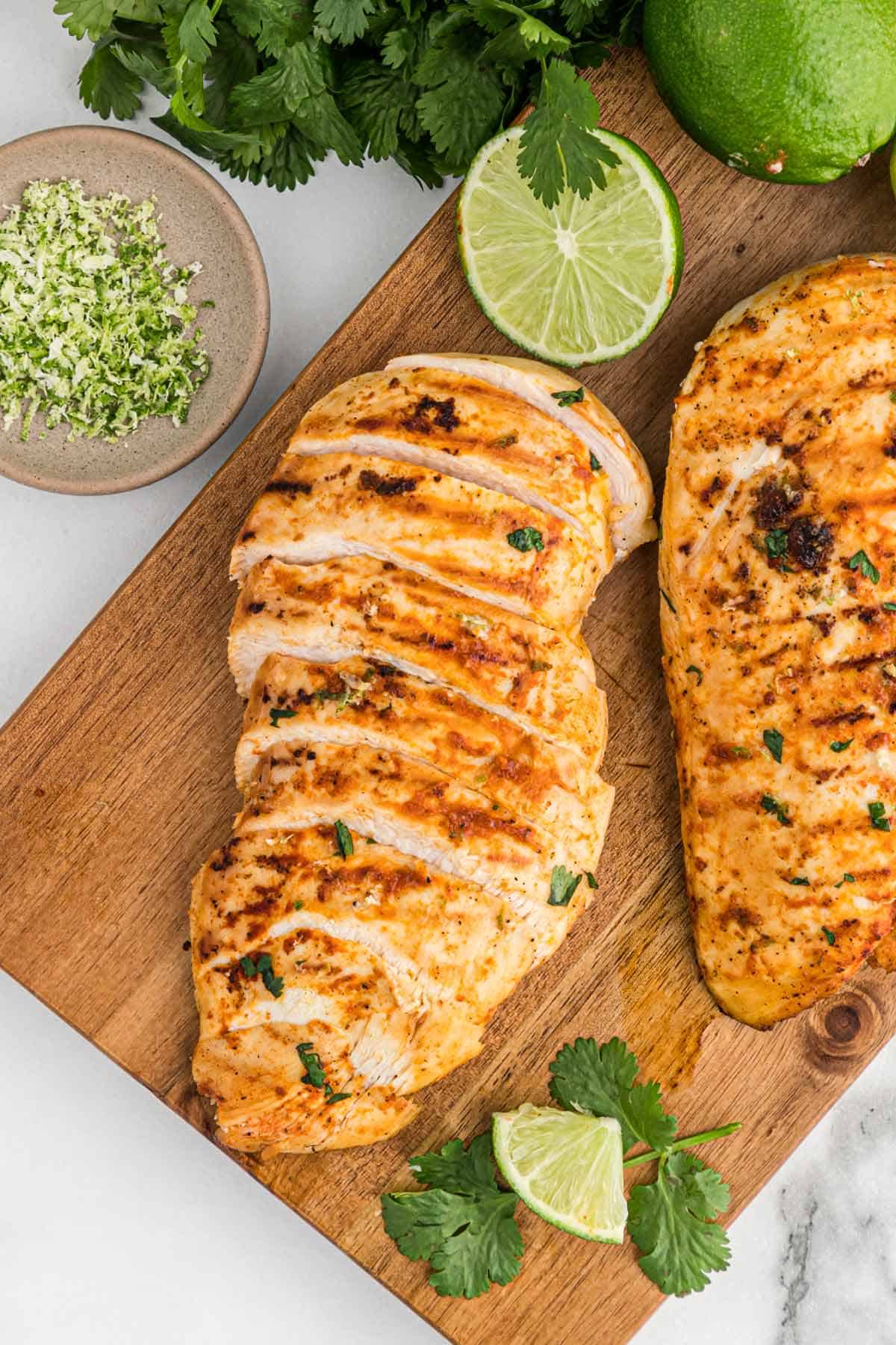 Chicken with tequila lime marinade after grilling on a cutting board.