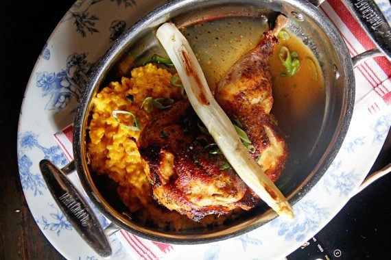 Overhead shot of baked chicken with rice at Finka Table and Tap