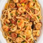 A large white platter of cajun jambalaya pasta