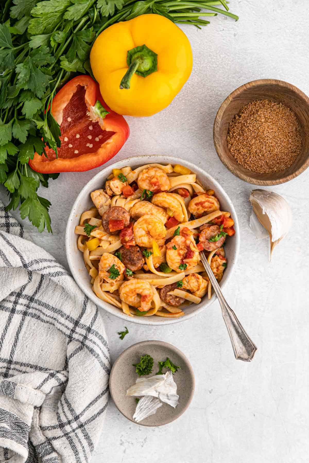 A bowl of cajun jambalaya pasta on the table.