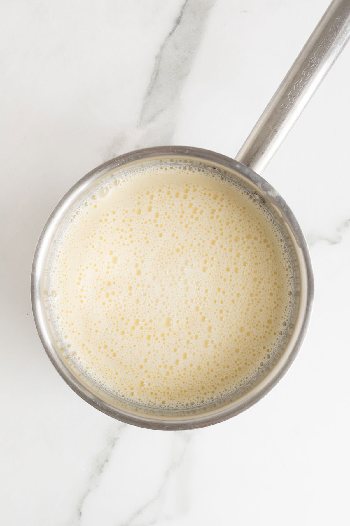 The custard mixture looking foamy after whisking