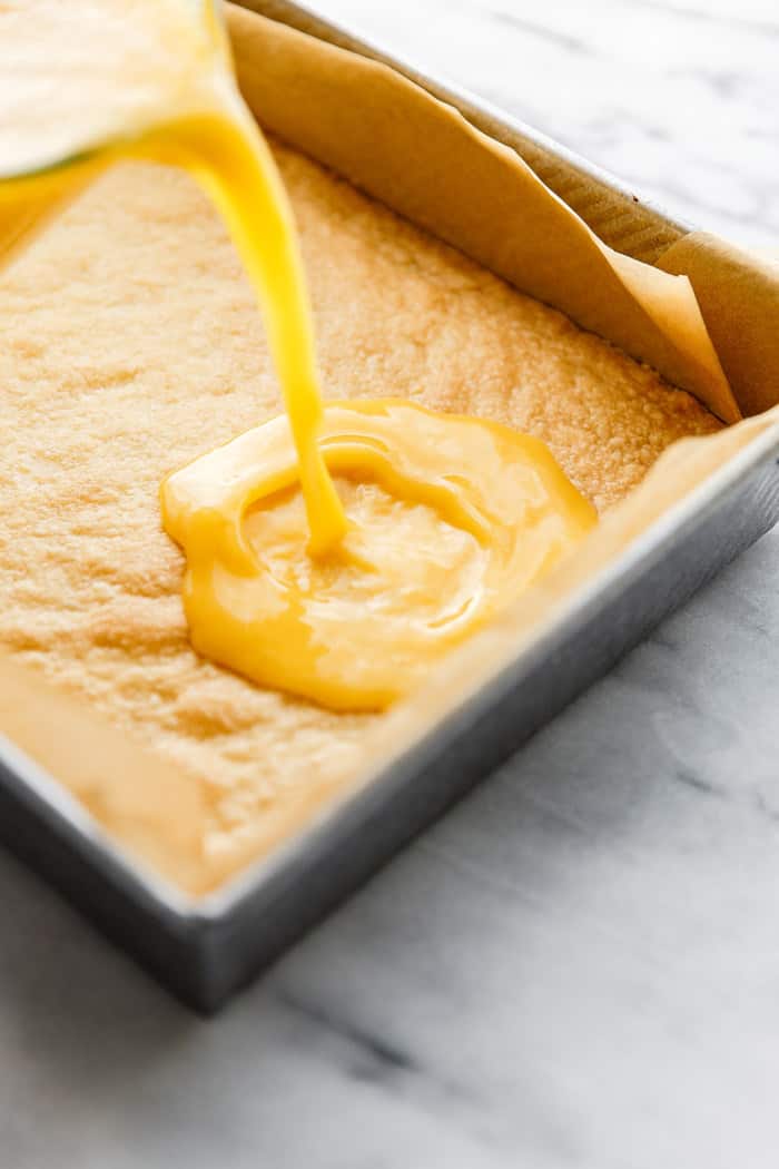 Lemon mango mixture poured on top of the shortbread crust.