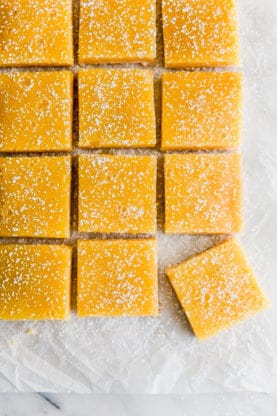 Overhead shot of Mango Lemon Bars cut into squares.