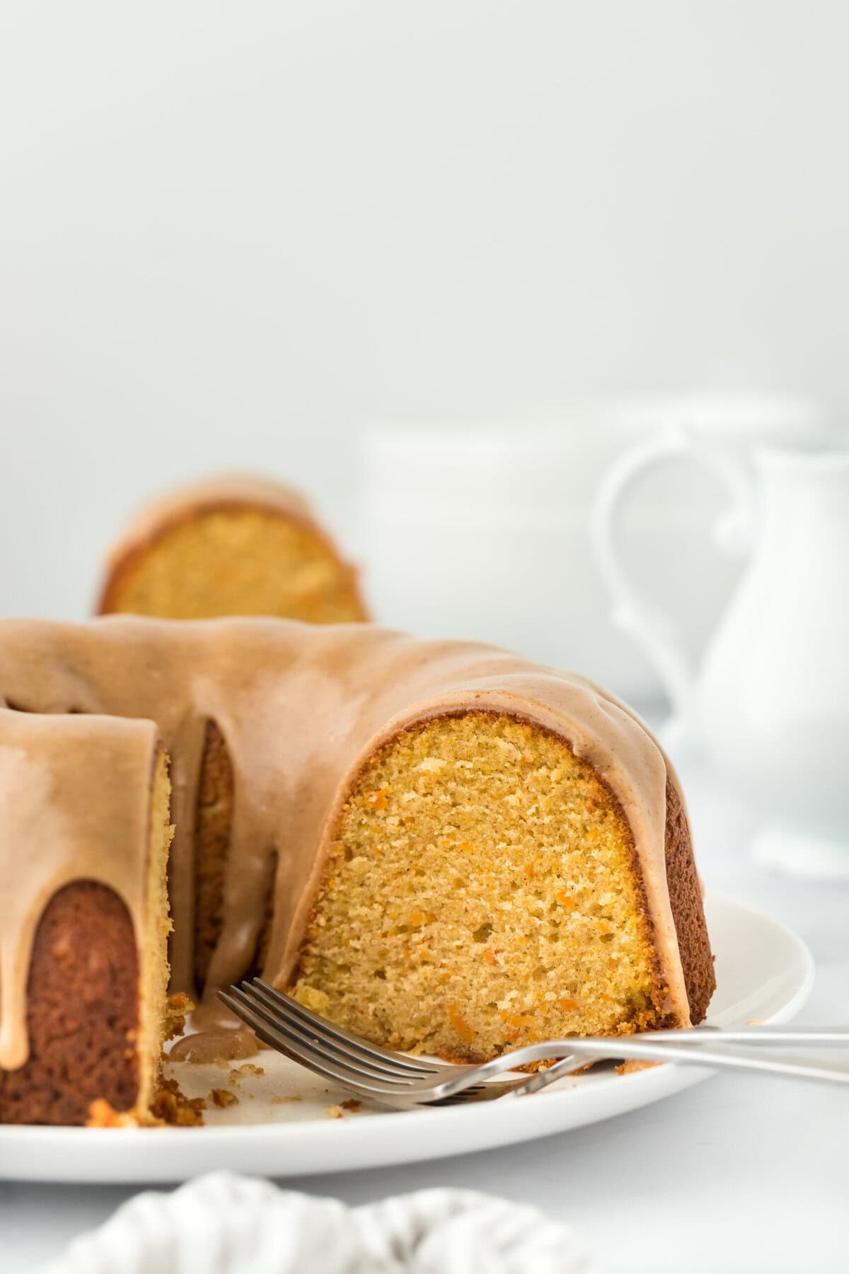 A sliced sweet potato cake on a white plate