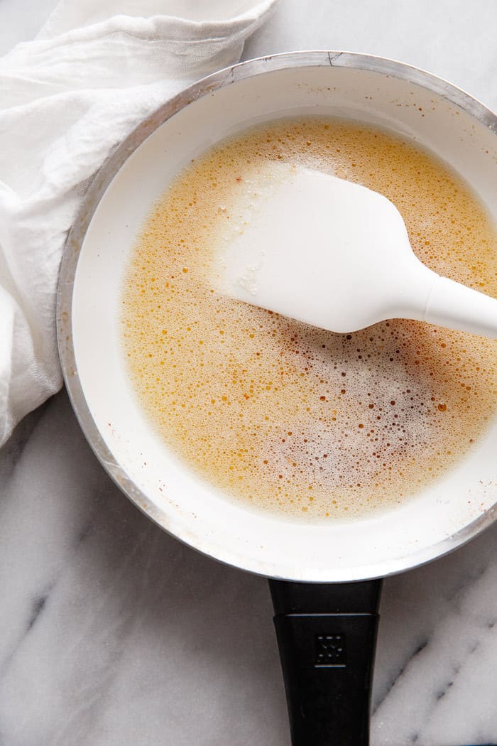 A tutorial photo of How to Make Brown Butter Frosting for Moist Apple Cake Recipe