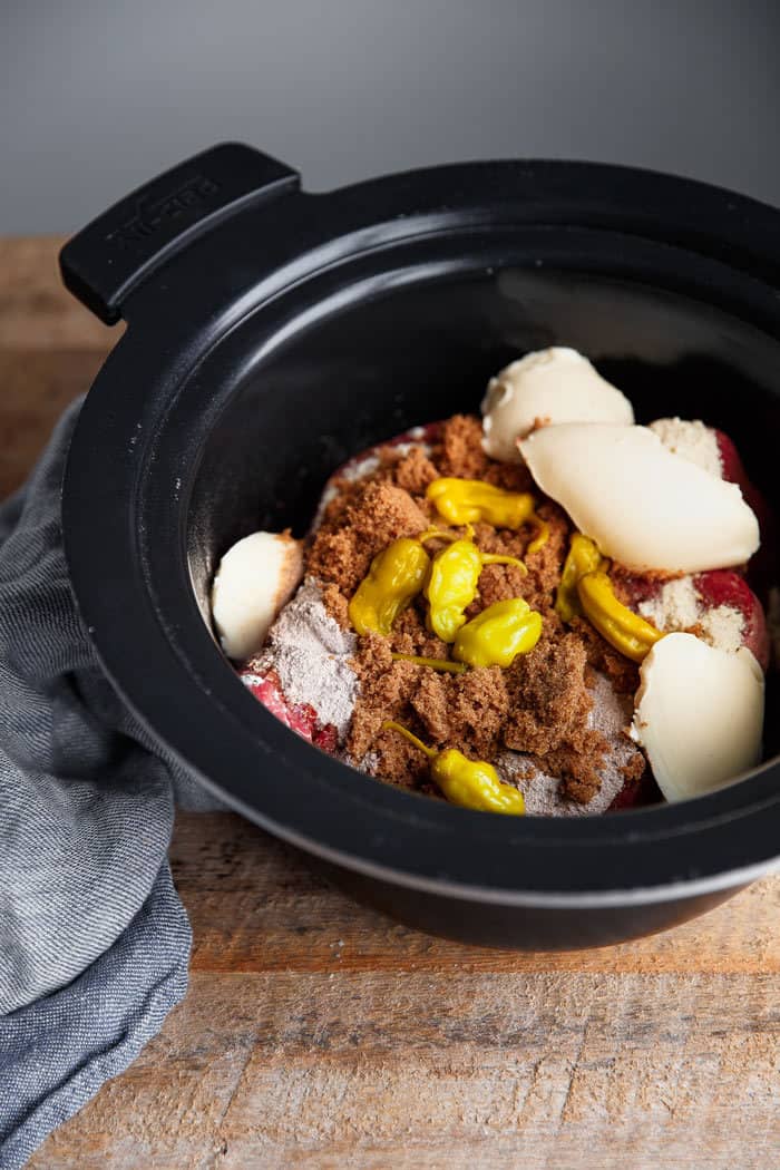 Slow Cooker Pot Roast Recipe ingredients in a slow cooker container ready to be cooked