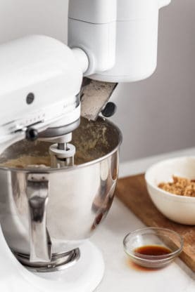 Ingredients being mixed for Sweet Potato Cake in a KitchenAid electric blender