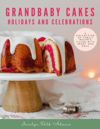  Grandbaby Cakes Southern Holiday recipes and Celebrations Cookbook Cover displays a sliced red velvet marble cake on a cake stand