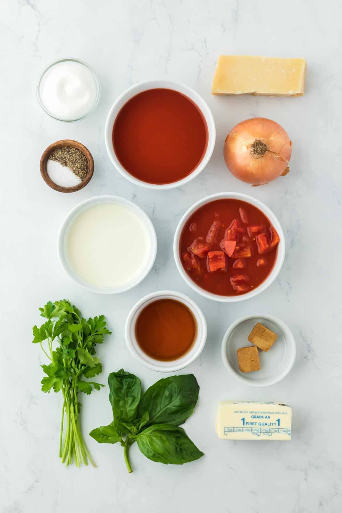 Overhead shot of the ingredients for making homemade tomato basil soup