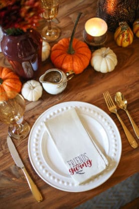 White napkin overhead on wood table at Friendsgiving ideas photo shoot