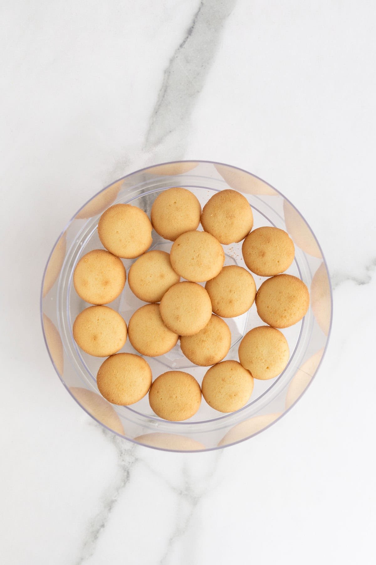 Nilla wafers on the bottom of a trifle bowl