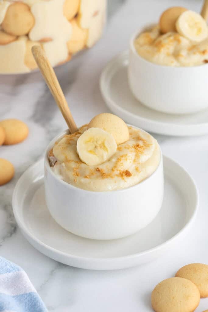 Two white bowls of banana pudding ready to enjoy