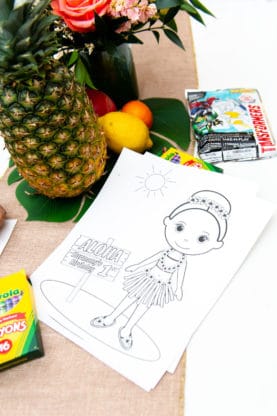 Children's activities for the party including crayons and a coloring sheet with a display of fruits in the background