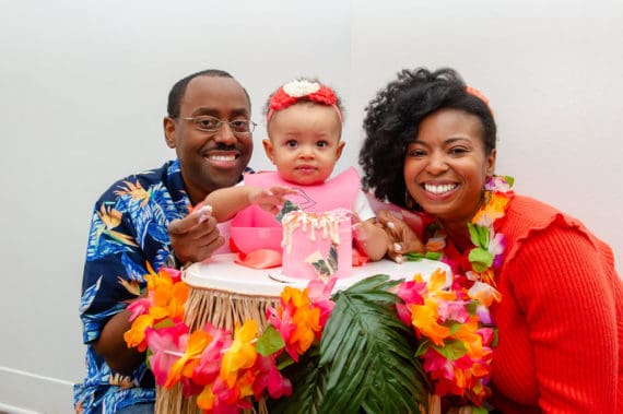 Harmony and her parents pose for a photo