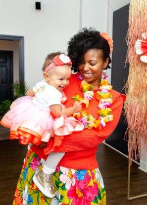 Jocelyn holding Baby Cakes Harmony at her First Birthday Party Hawaiian Luau